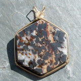 Wire Wrapped Zincite, Franklinite, and Calcite Pendant